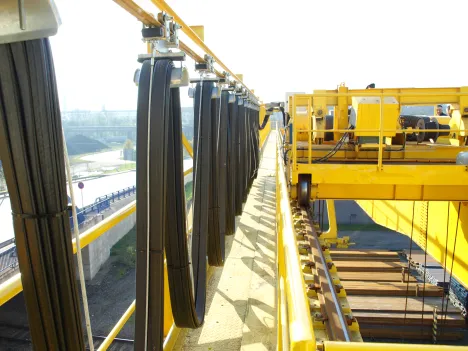 Process Crane with electromagnet at a loading facility in a steel mill