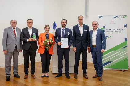The picture shows the award winners at the ceremony.